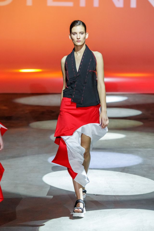 alena steinke love collection berlin black top with red stitching and cut out asymmetric skirt